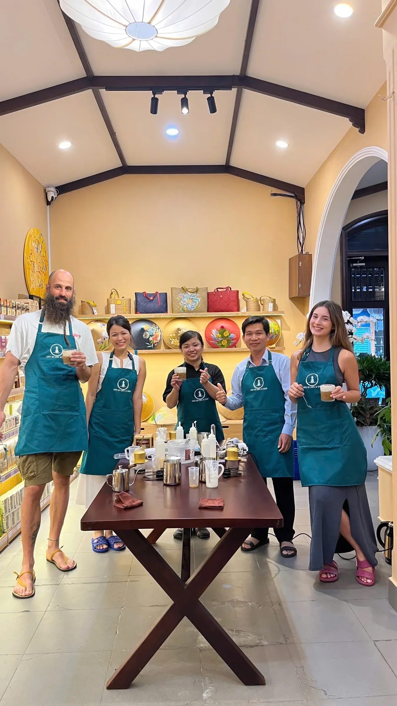 Guests brewing coffee together at the Cam On Cafe workshop